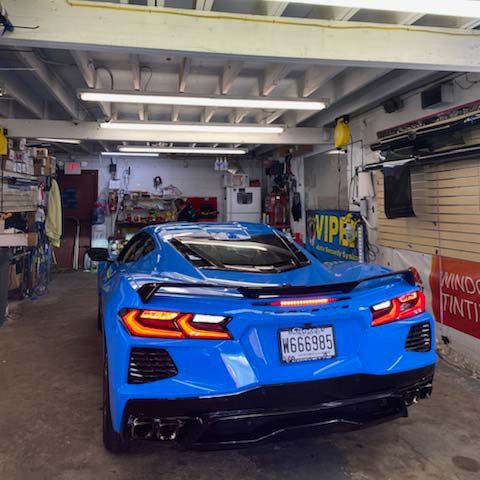 A blue Corvette in Bumper to Bumper Car Audio's garage
