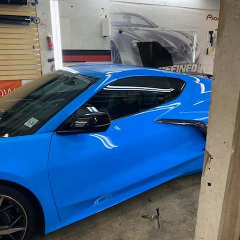 A blue Corvette in Bumper to Bumper Car Audio's garage