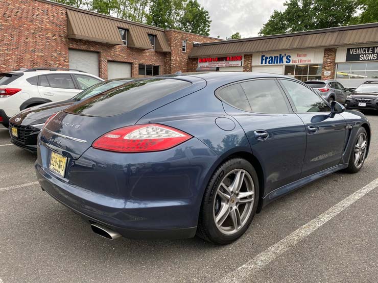 A dark blue Porsche
