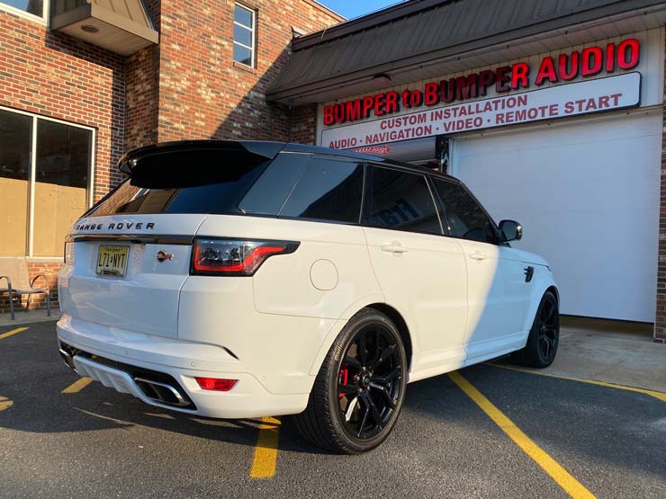 A white Range Rover in front of Bumper to Bumper Car Audio